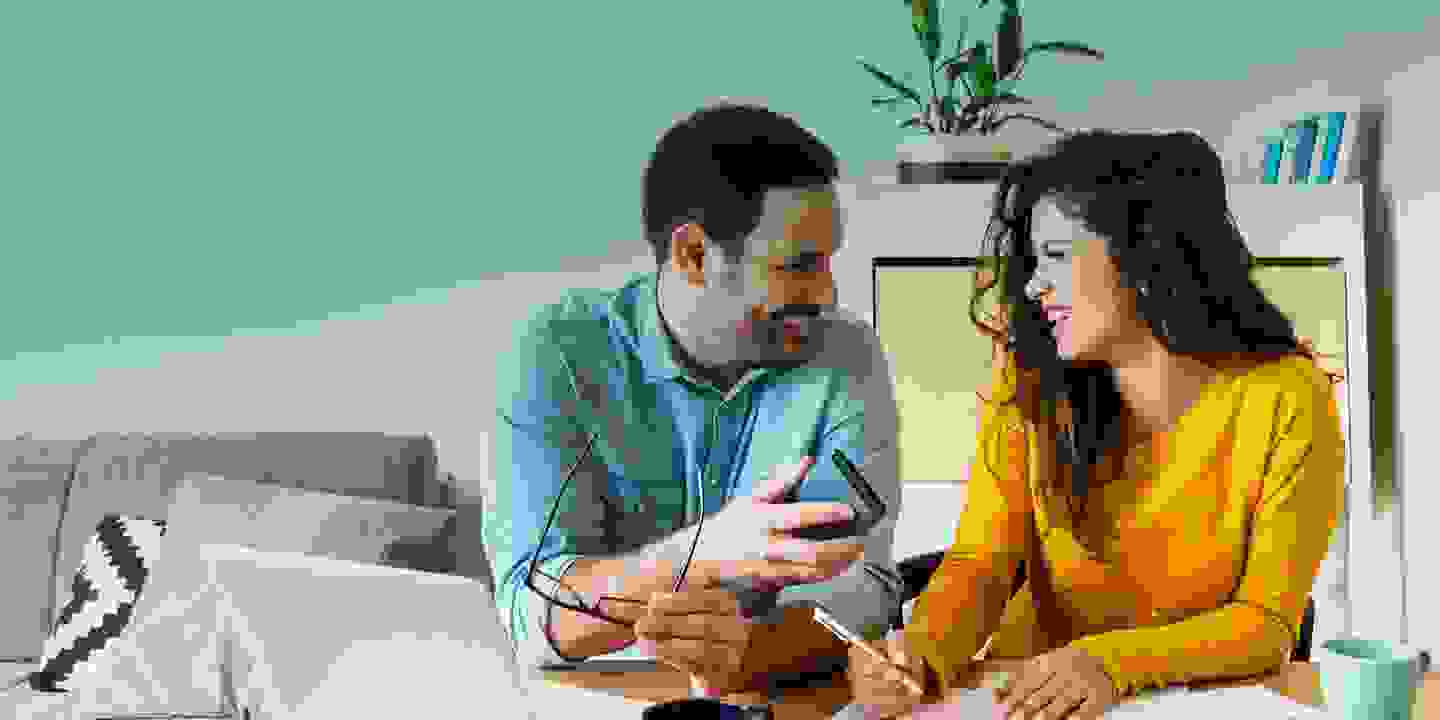 Young-couple-discuss-bills-home